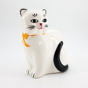 Vintage White Ceramic Cat coin bank.